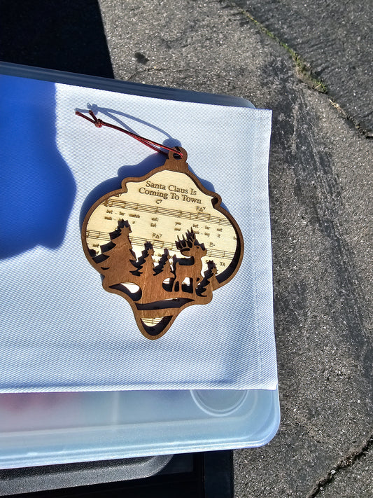 Engraved santa is coming to town ornament